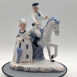Vintage Deville Colonial Style Elegant Porcelain Figurine with Blue Accents